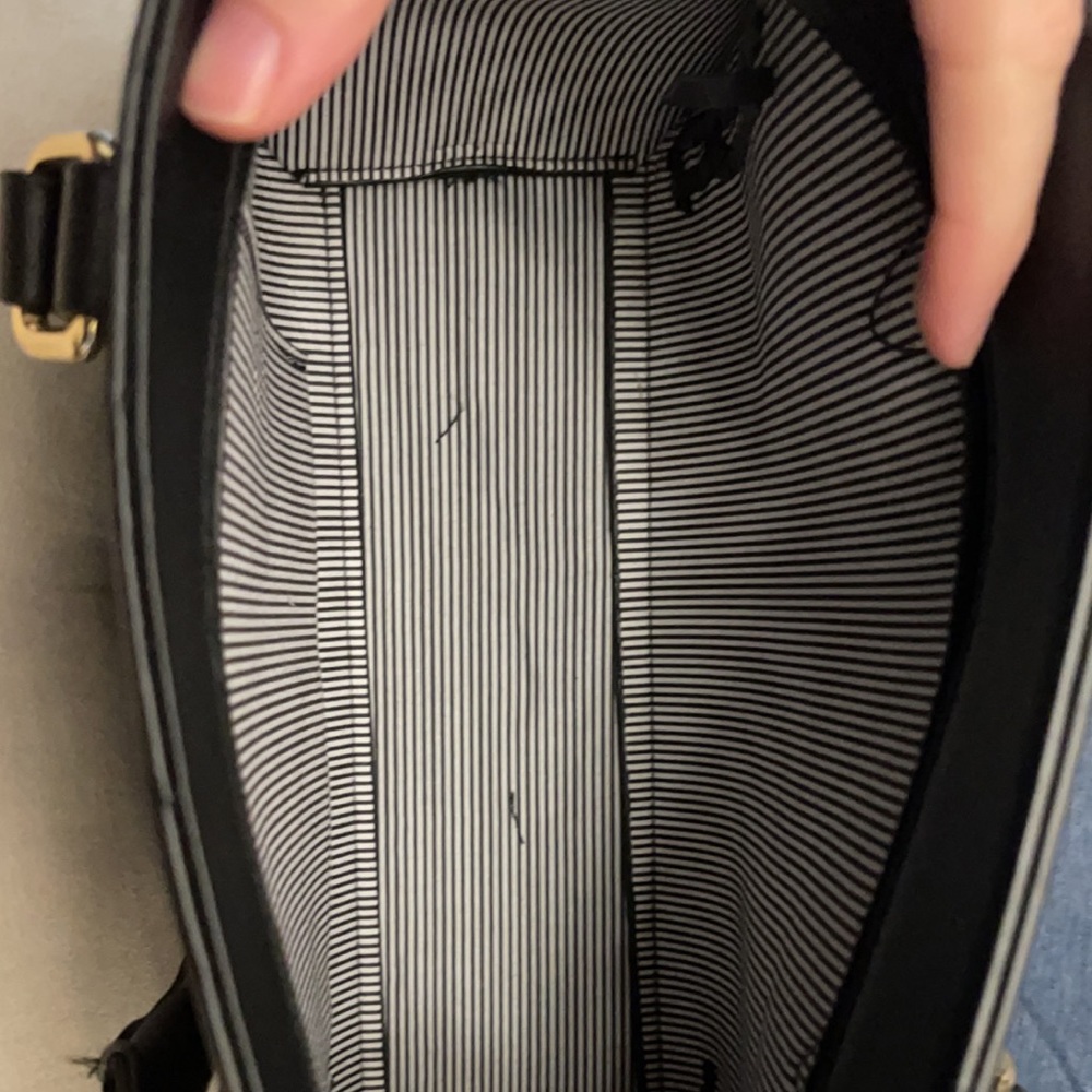 Small, open black purse